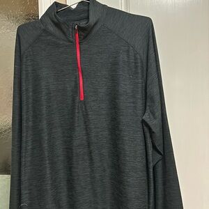 Dark gray , long sleeve, 1/2 front zippered jersey. Size L. Polyester/spandex.